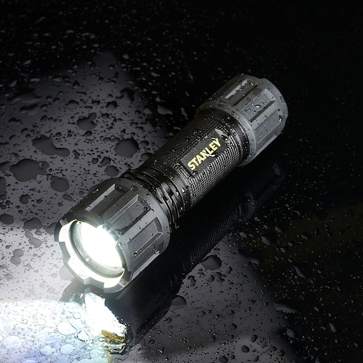 STANLEY SXLS50102E black LED flashlight, rugged design, water-resistant, front angle photography.