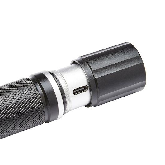 STANLEY SXLS50104E photography of black and silver textured flashlight side angled on white background.