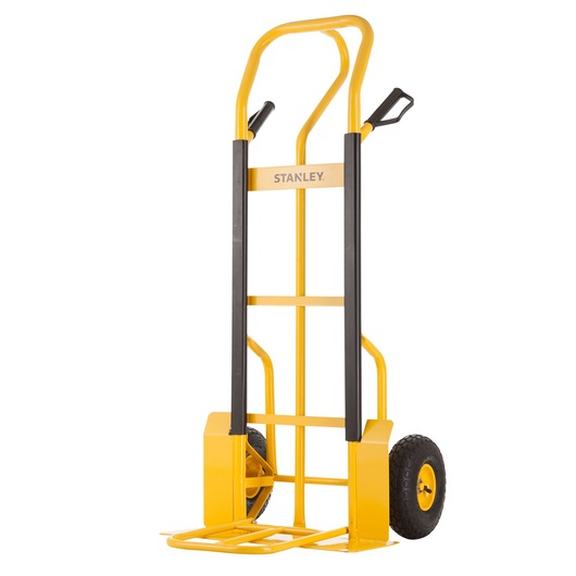 Yellow Stanley hand truck with black handles and wheels, used for moving heavy items. Upright design on white background.