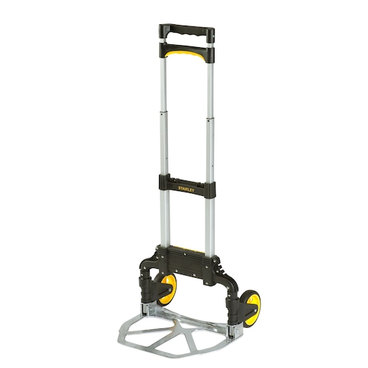 Stanley foldable hand truck with yellow wheels and telescopic handle, suitable for transporting heavy items.