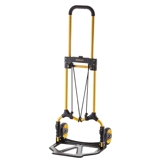 Stanley SXWTD-FT580 folding hand truck with yellow frame and black wheels for transporting items.