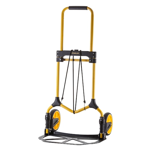 Stanley foldable yellow hand truck with black wheels and handle, shown upright against a white background.